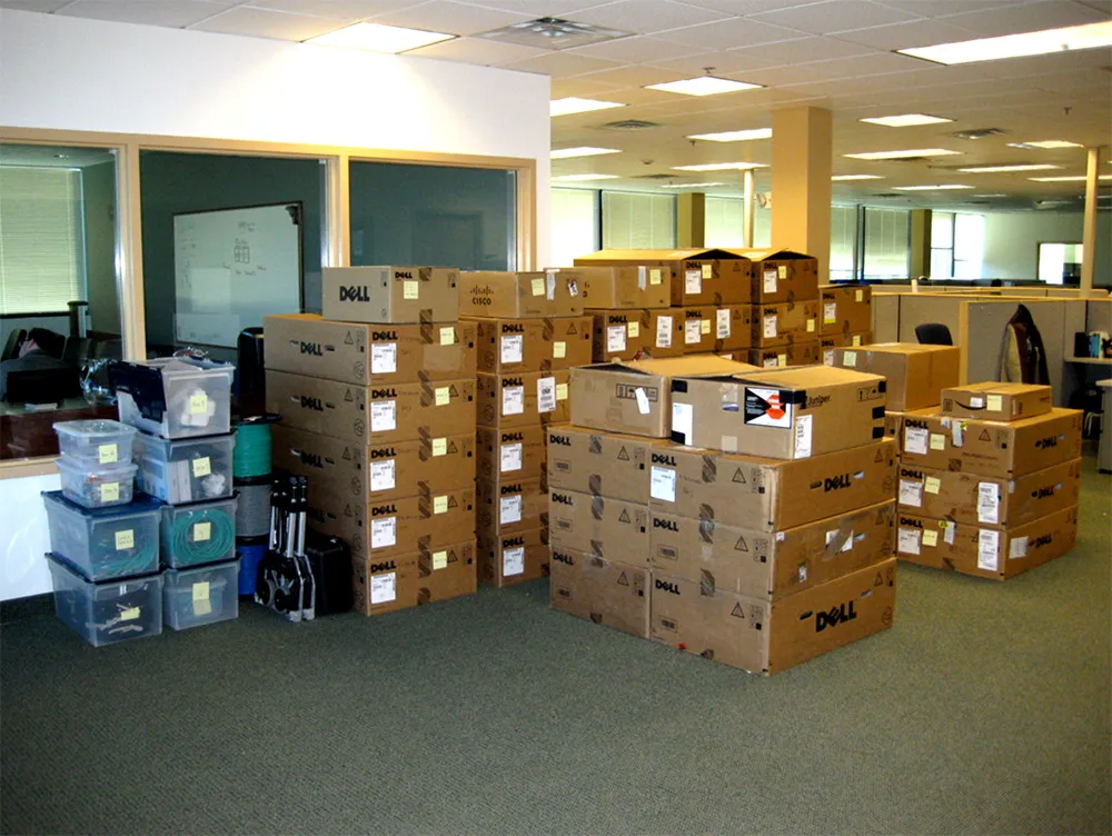Piled boxes of network tools inside office